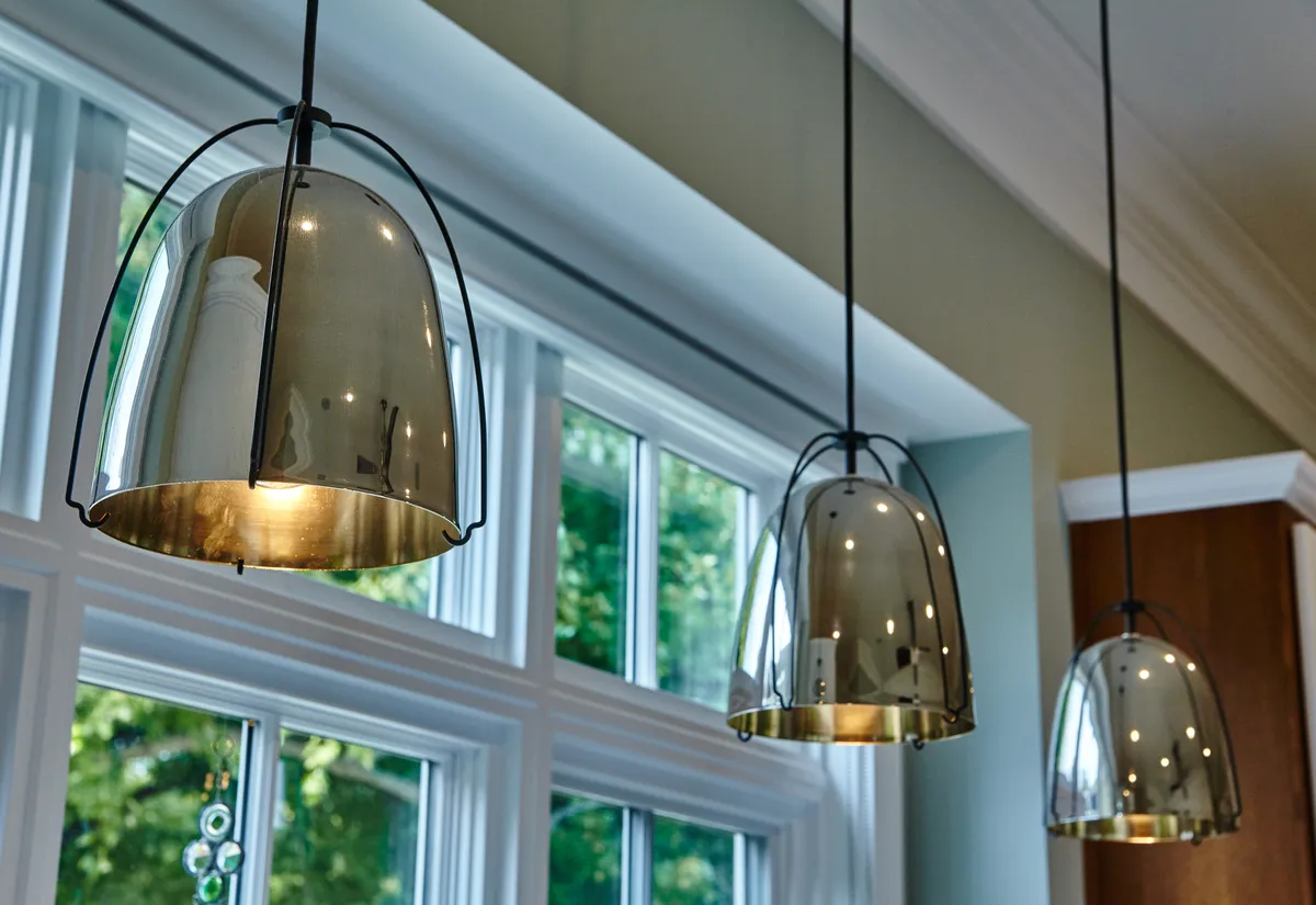A close-up of modern pendant lighting installed in a home